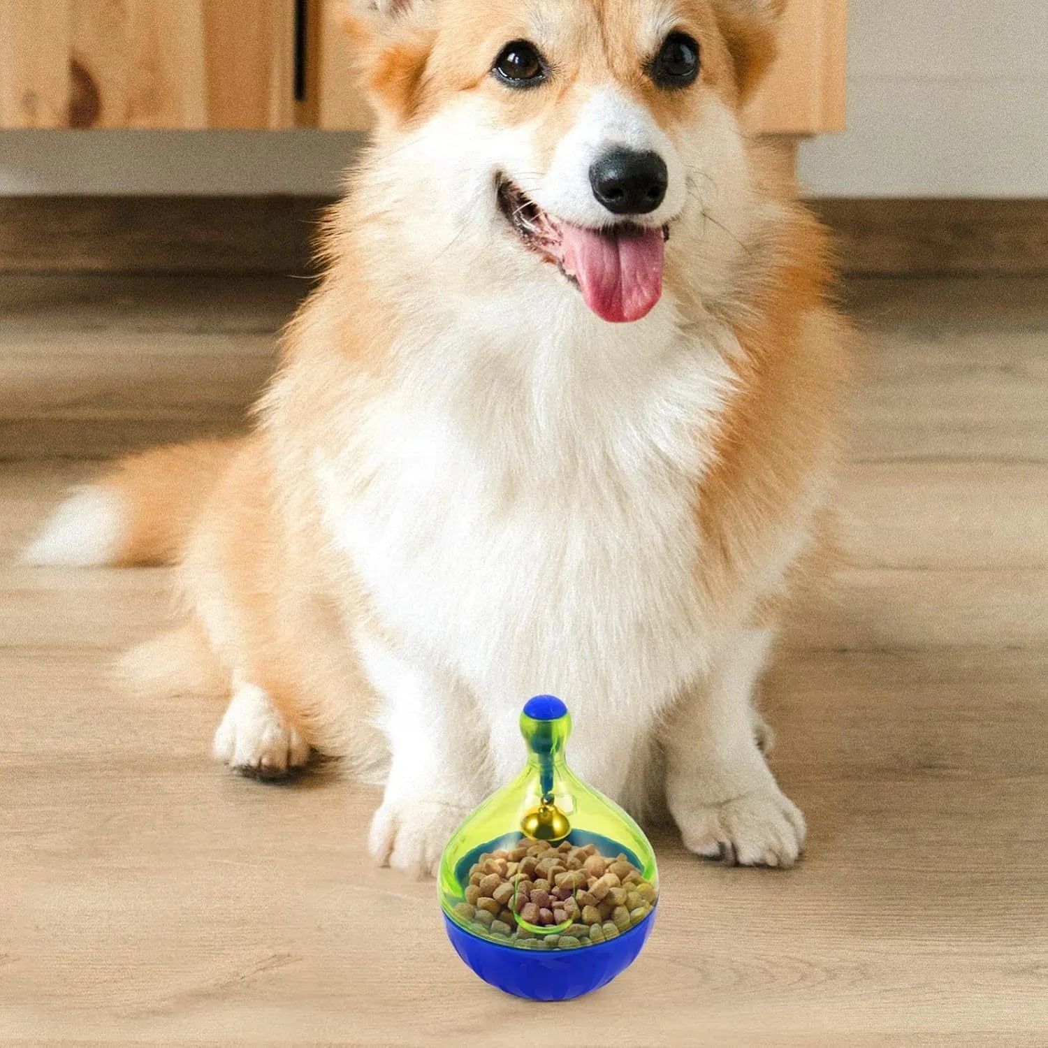 Blue tumbler-shaped dog and cat treat dispenser ball with food opening for interactive pet play