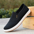 Men's low-top canvas slip-on shoes in blue colour showing round toe and shallow mouth design