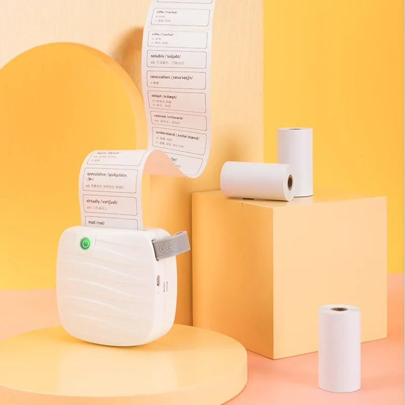 Three rolls of 57mm wide thermal paper in packaging for portable printers