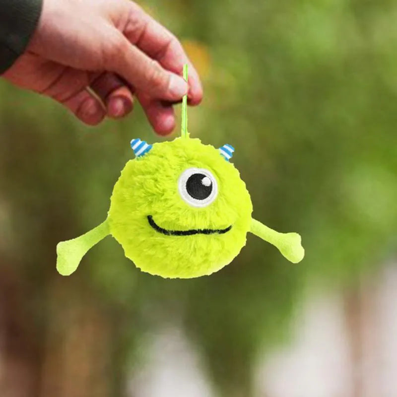 Green plush and TPR dog toy ball for interactive teething and play.