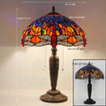 Stone table lamp with Tiffany-style blue dragonfly design on base