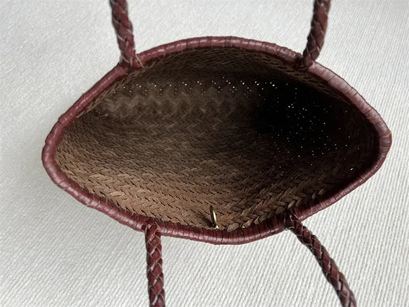 Brown handmade woven tote bag with three-dimensional pocket design and cowhide leather construction