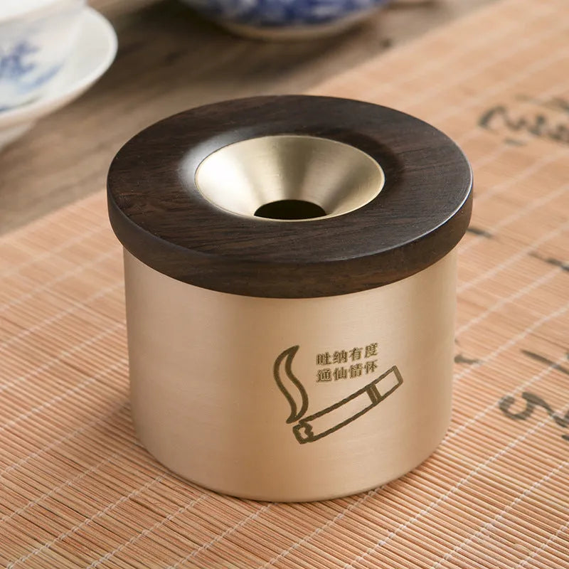 Retro solid copper ashtray with a wooden lid showing the centre hole.