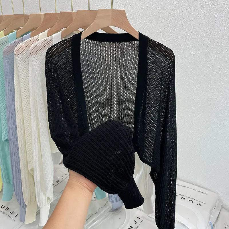 Women's hollow thin loose blouse with lantern sleeves in apricot colour showing slim fit and hollow-out detailing