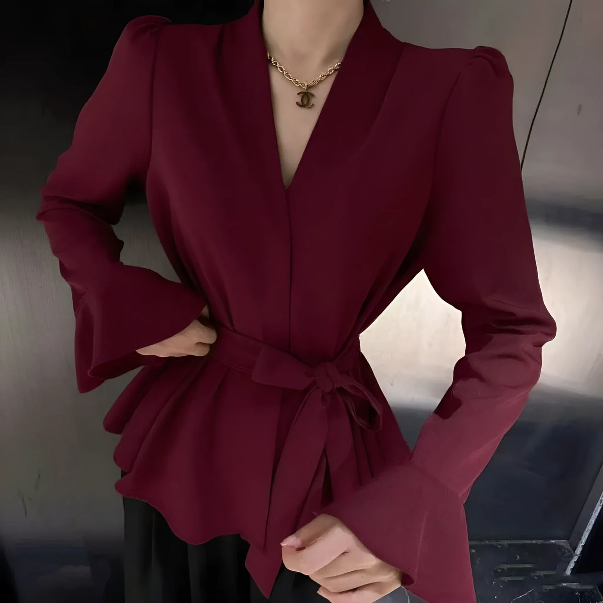 Women's French-style irregular collar long sleeve shirt with bell sleeves in wine red.