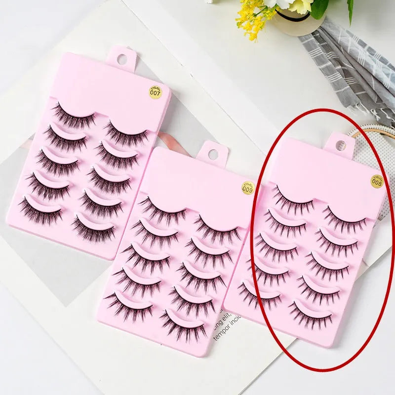 5 pairs of natural wispy manga false eyelashes on a black background, showing styles 007, 008, and 009 with plastic black terrier.