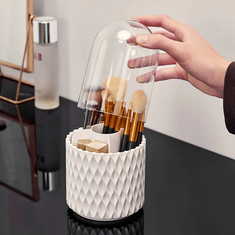 White rotating transparent makeup brush storage organiser with dust cover on desktop