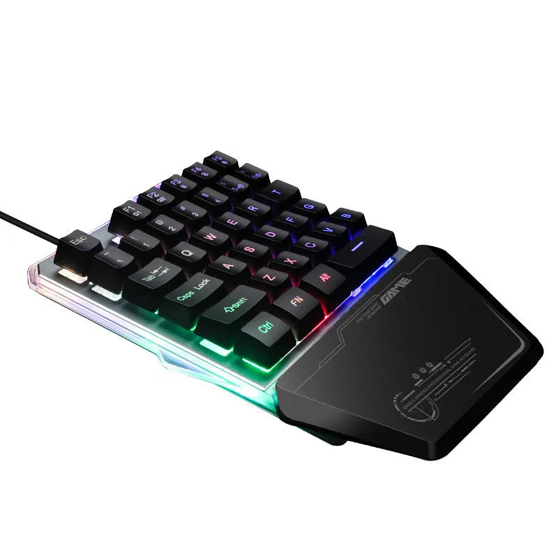 Black robotic one-handed gaming keyboard with RGB backlit keys and USB cable