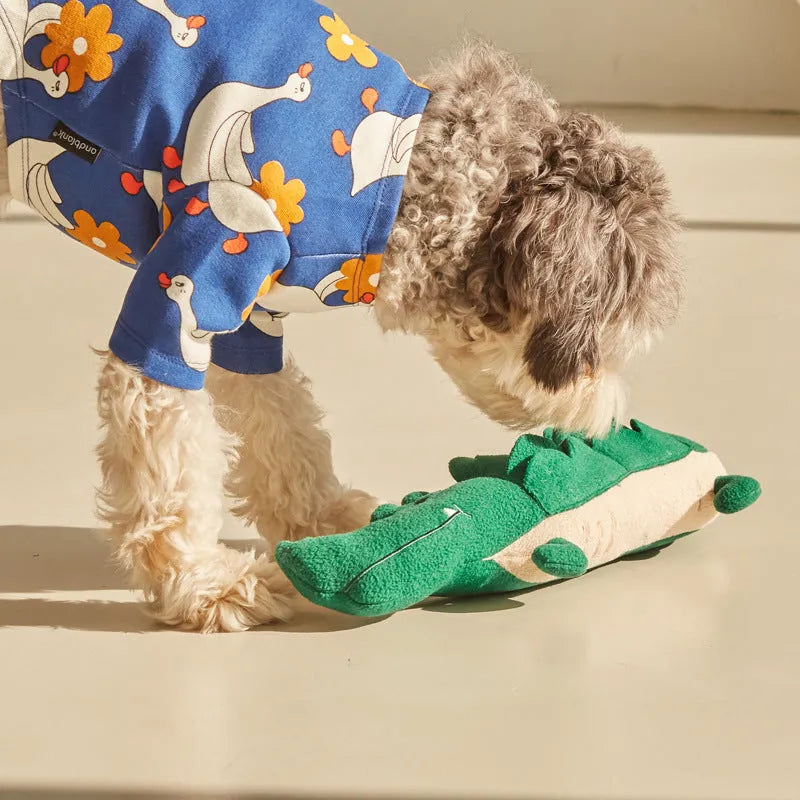 Green plush dog toy measuring 35cm long with soft texture for children's play