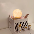 Maglev floating planet night light with LED illumination and astronaut figurines