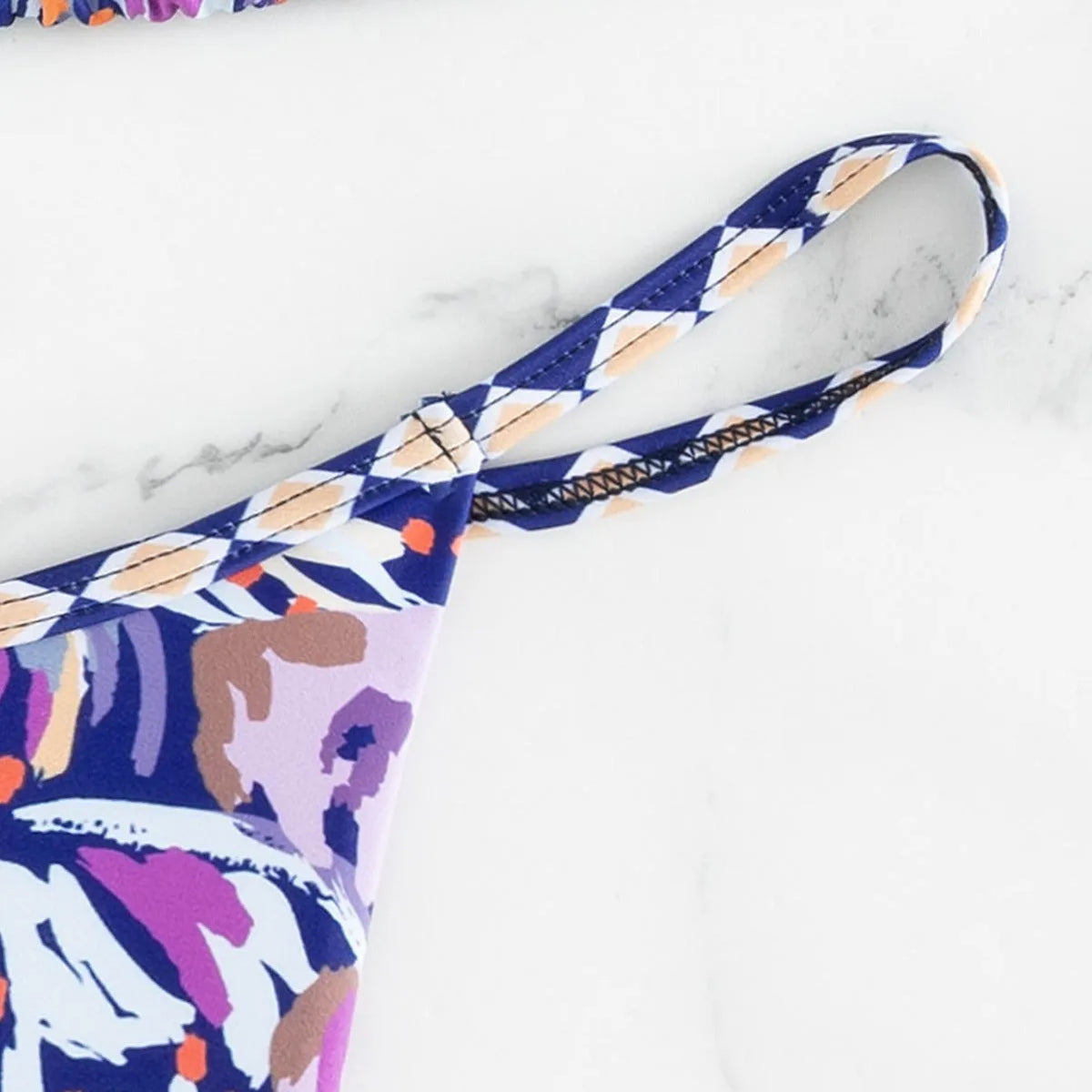 Women's floral print polyester swimsuit with triangle bag top and briefs bottom