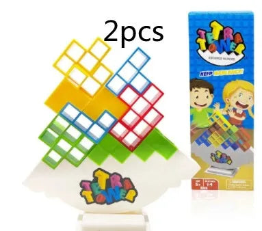 Plastic balance stacking board game with 16 coloured blocks, chassis, and base on a table