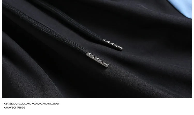 Black and grey loose fit sports shorts with elasticated waistband and tie closure