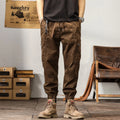Men's tapered harem pants in cotton fabric showing ankle banded design and small leg opening