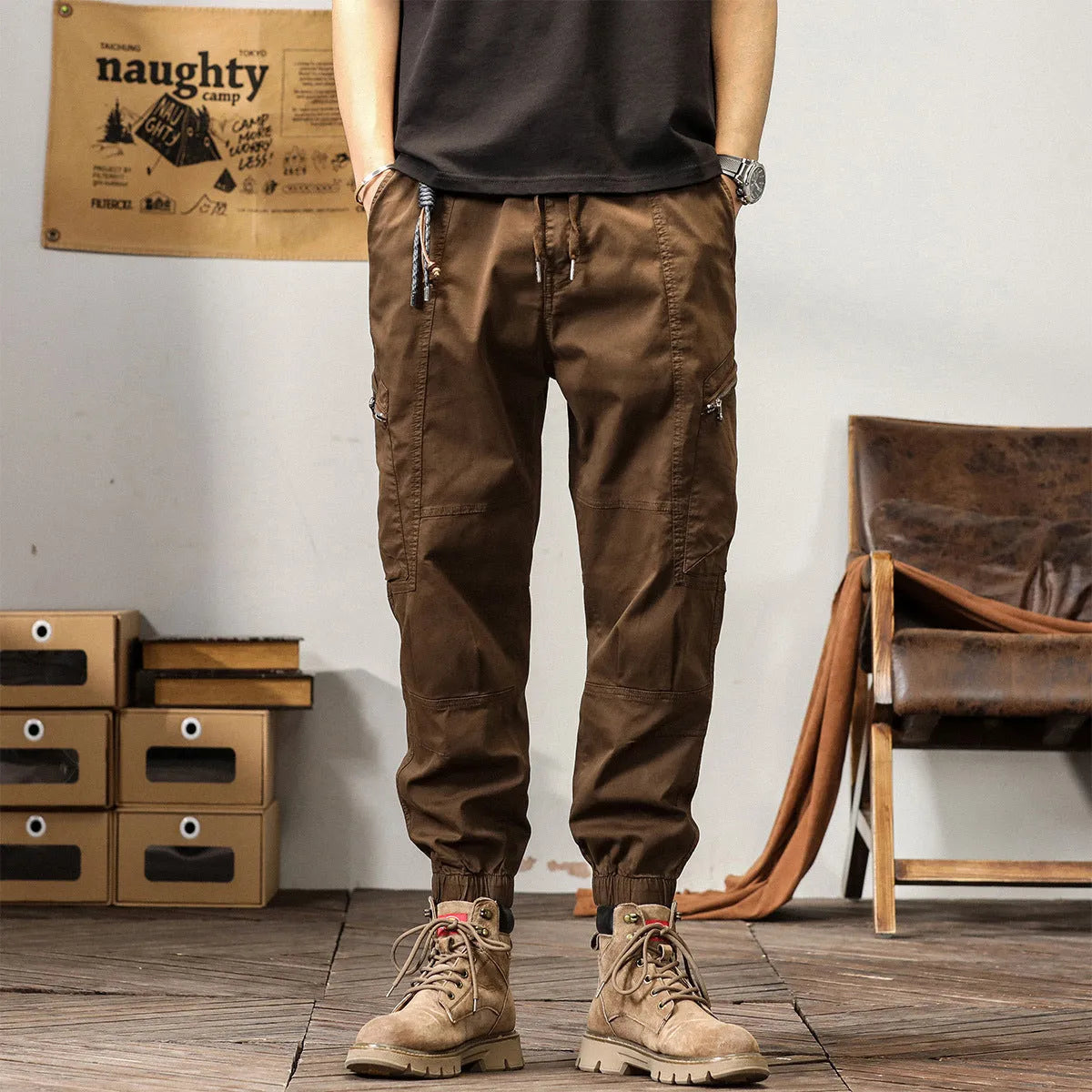 Men's tapered harem pants in cotton fabric showing ankle banded design and small leg opening