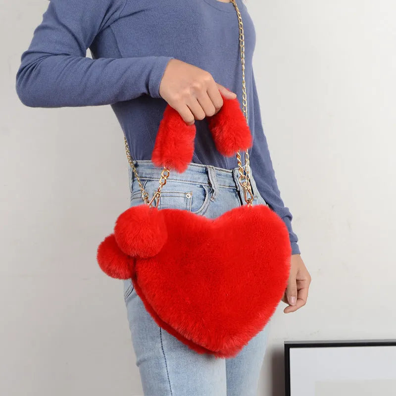 Medium sized soft plush heart-shaped women's handbag in a choice of fourteen colours with a synthetic leather lining