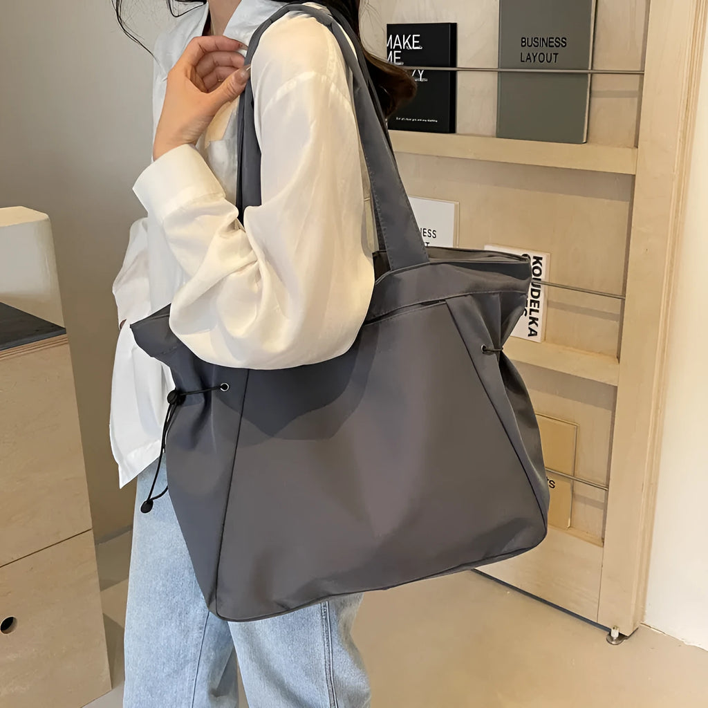 Soft Oxford cloth foldable tote bag in street style, shown in available colours.