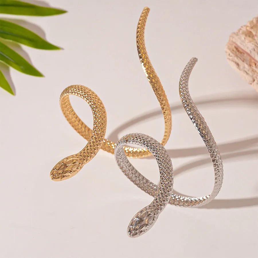 Gold and silver tone snake motif ring and bracelet set with twisted winding design