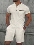 Men's grey waffle texture zip-front polo collar short sleeve top and matching shorts suit set.