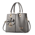 Retro PU leather handbag with shoulder strap and zipper closure in multiple colour options