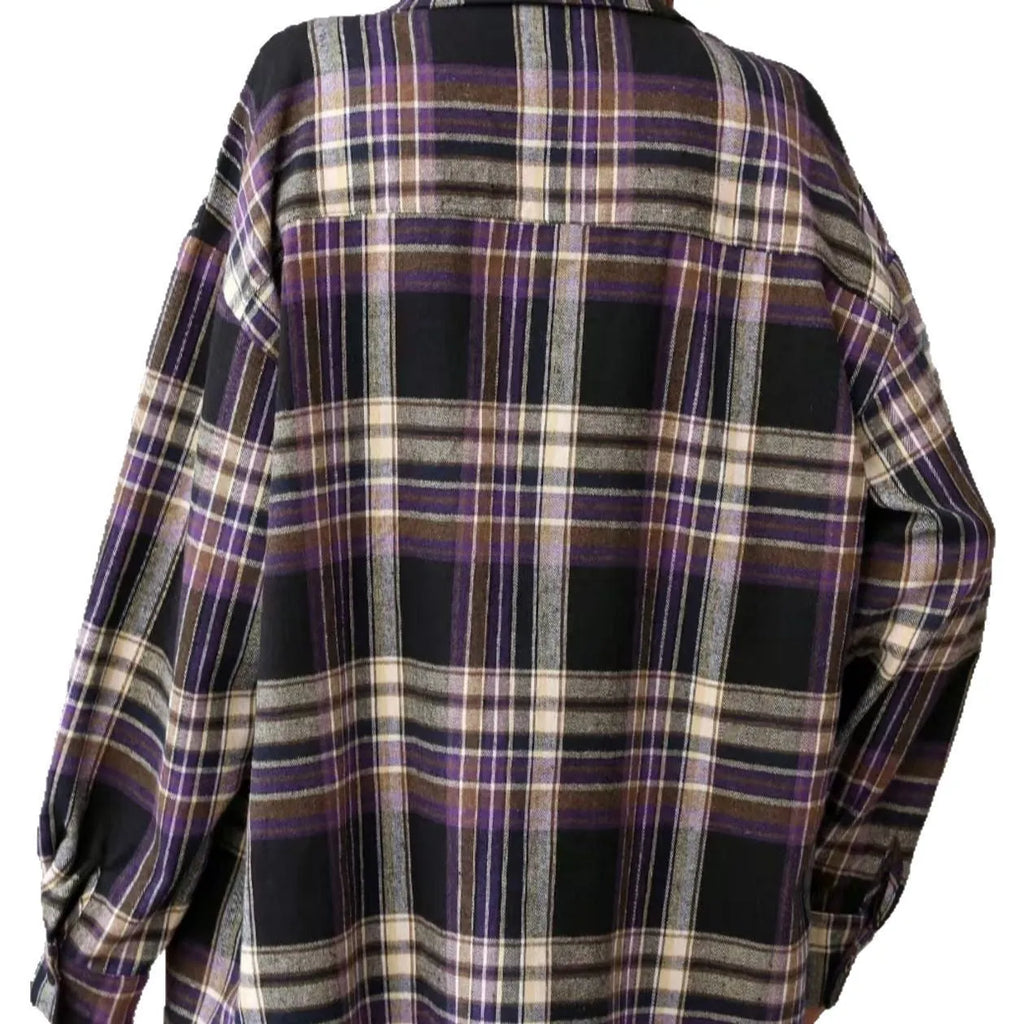 A woman's loose-fit long sleeve plaid shirt in a casual retro style, shown on a hanger.