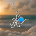 Silver geometric octopus pendant necklace with inlaid opal gemstone on a box chain.