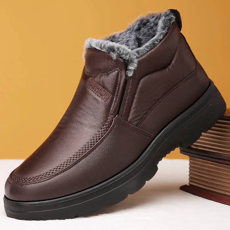 Men's black casual winter slip-on shoes with a waterproof PU upper and thick rubber sole.