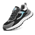 Men's low-top grey work shoes with shoelaces, featuring a plastic steel toe and a mesh and leather upper.