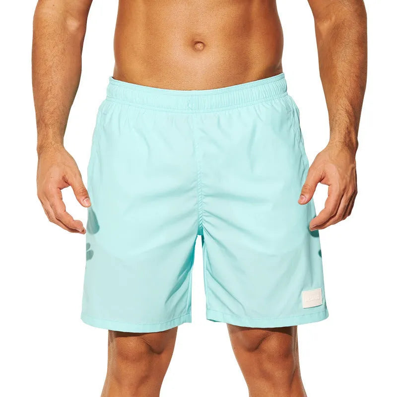 Men's quick-dry sports shorts in nylon fabric available in four colours with straight leg design