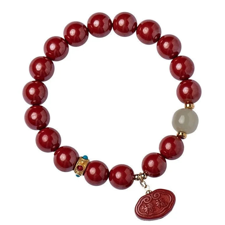 Natural red cinnabar bracelet with Ping An Fu Lu symbol carved in emperor sandstone style.