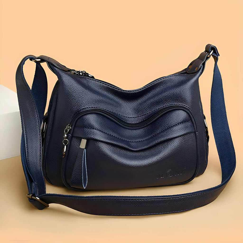 Large black or blue PU crossbody bag with organised internal compartments and soft handle