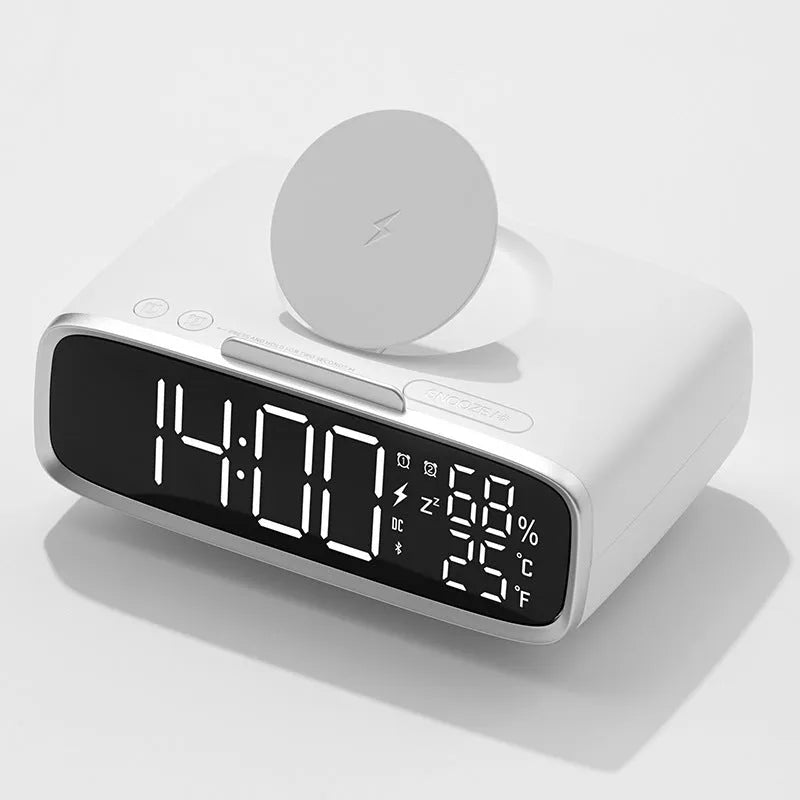 White wireless charging stand with built-in Bluetooth speaker and night light on bedside table