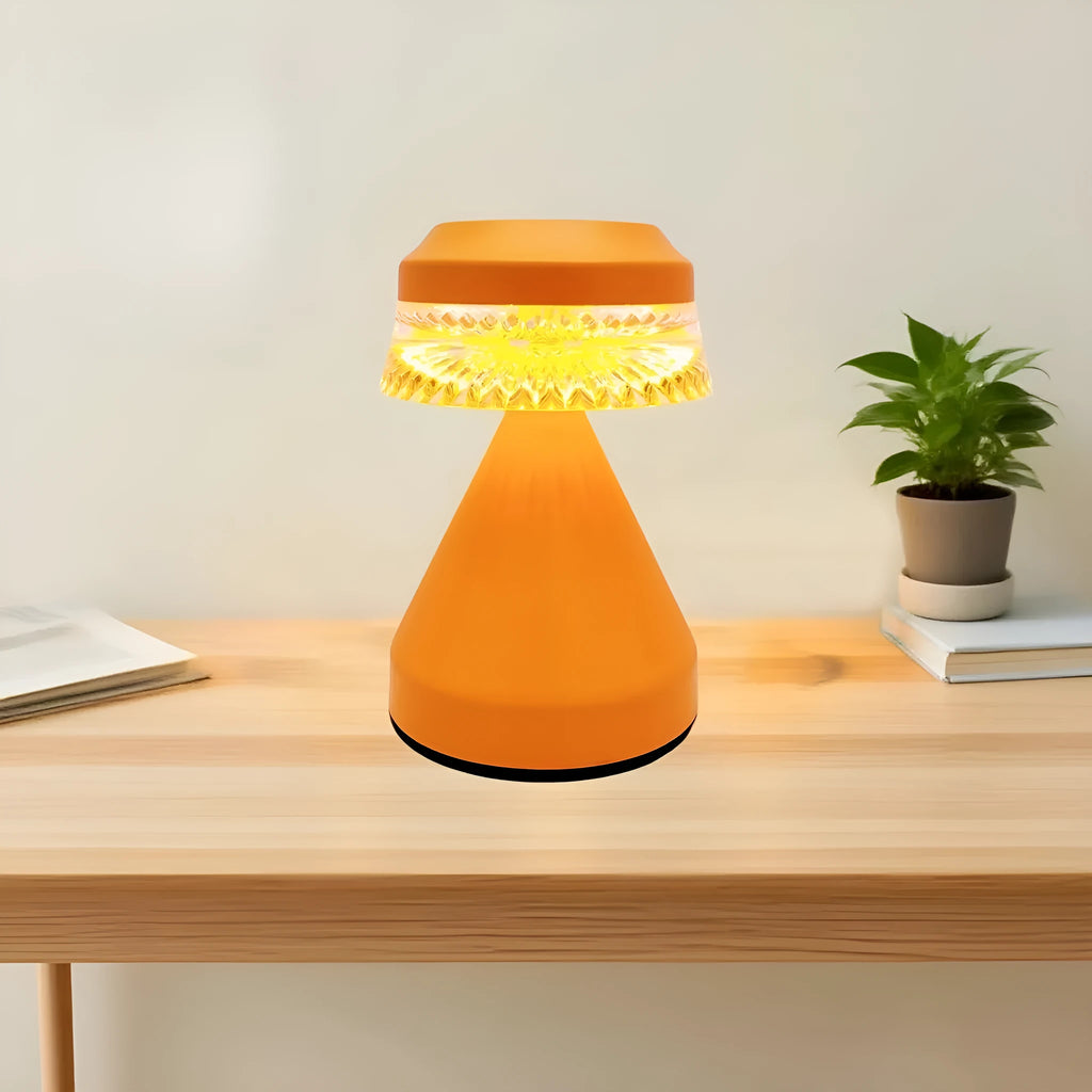 Creative USB-powered LED night lamp in black, brown, and orange colour options on a wooden surface.