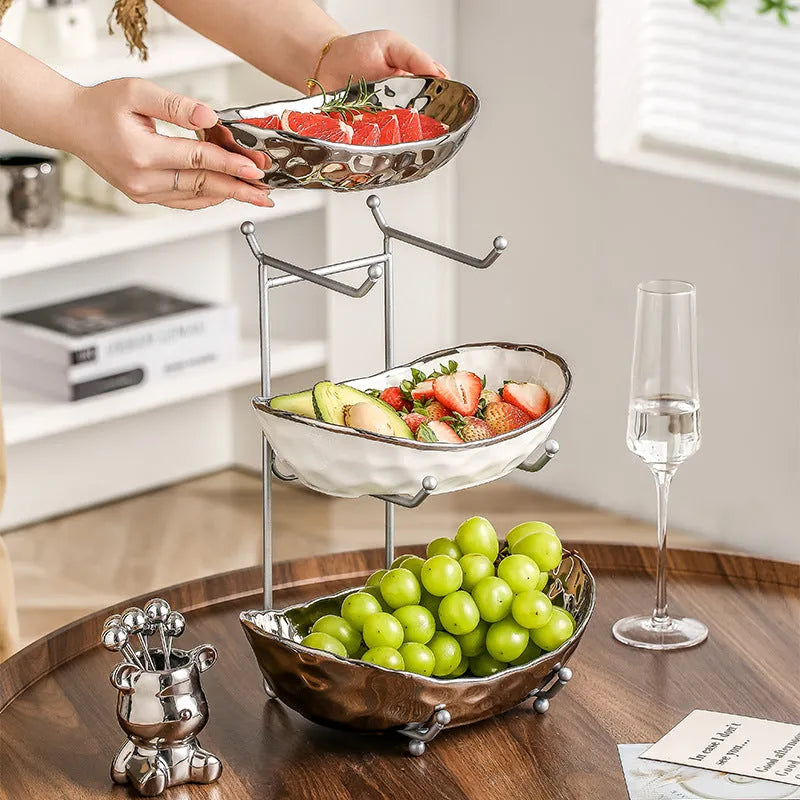 Multi-layer porcelain fruit tray with gold or silver electroplated stone texture frame, shown in double or triple tier.