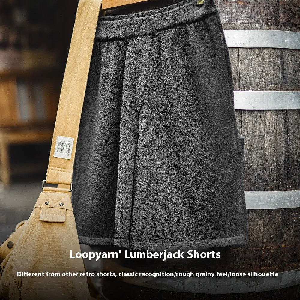Cement grey American-style loose fit straight leg sports shorts made from heavy polyester fabric.