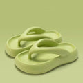 Solid colour thick-soled EVA flip-flops with a decorative bow on the strap