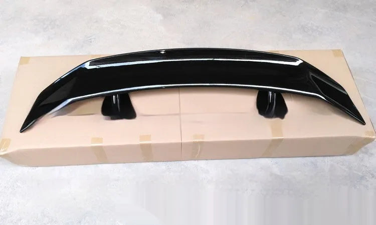 A bright black punch-free ABS plastic tail wing spoiler for cars.