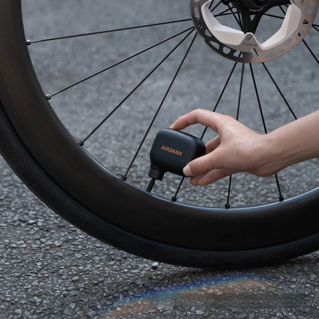 AS100 black plastic electric inflator pump for bicycles with USB charging cable and waterproof bag