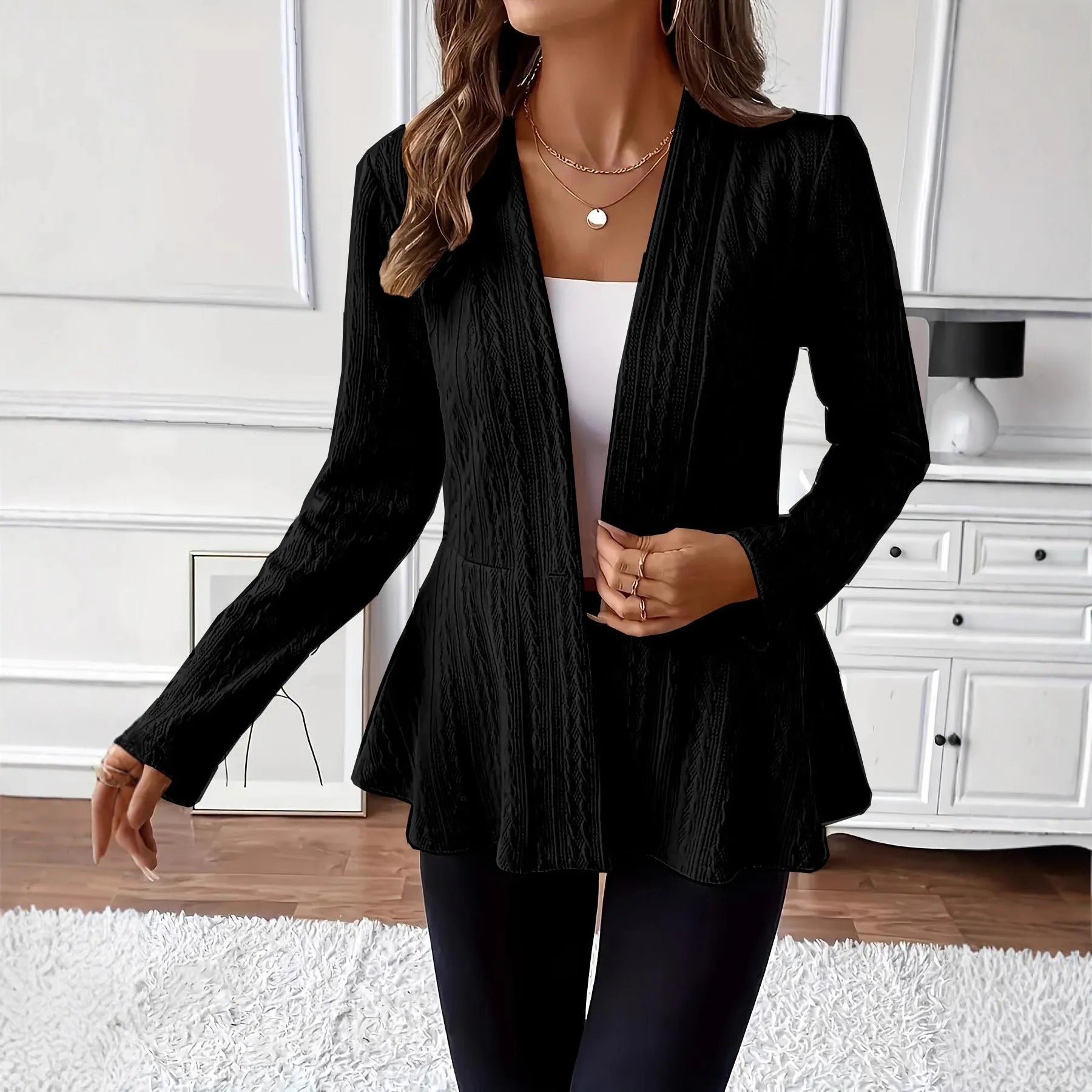 Women's apricot jacquard knit cardigan with one button front, shown on a model.