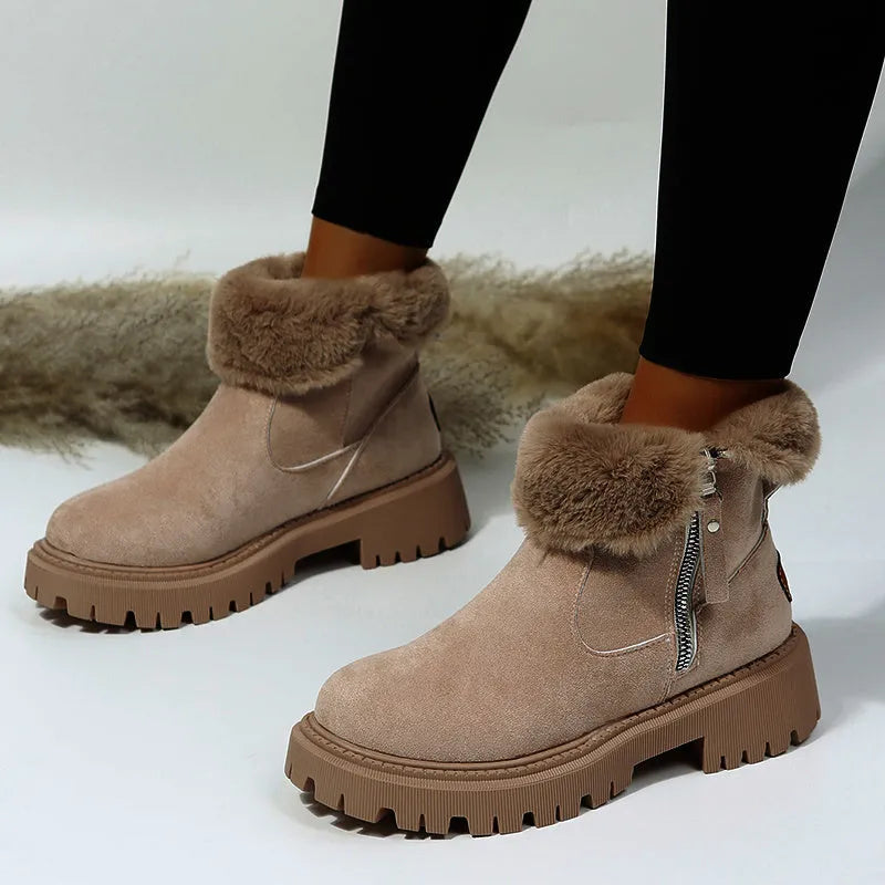 Women's black high-top snow boots with faux suede uppers, side zipper, and fluffy fur lining.
