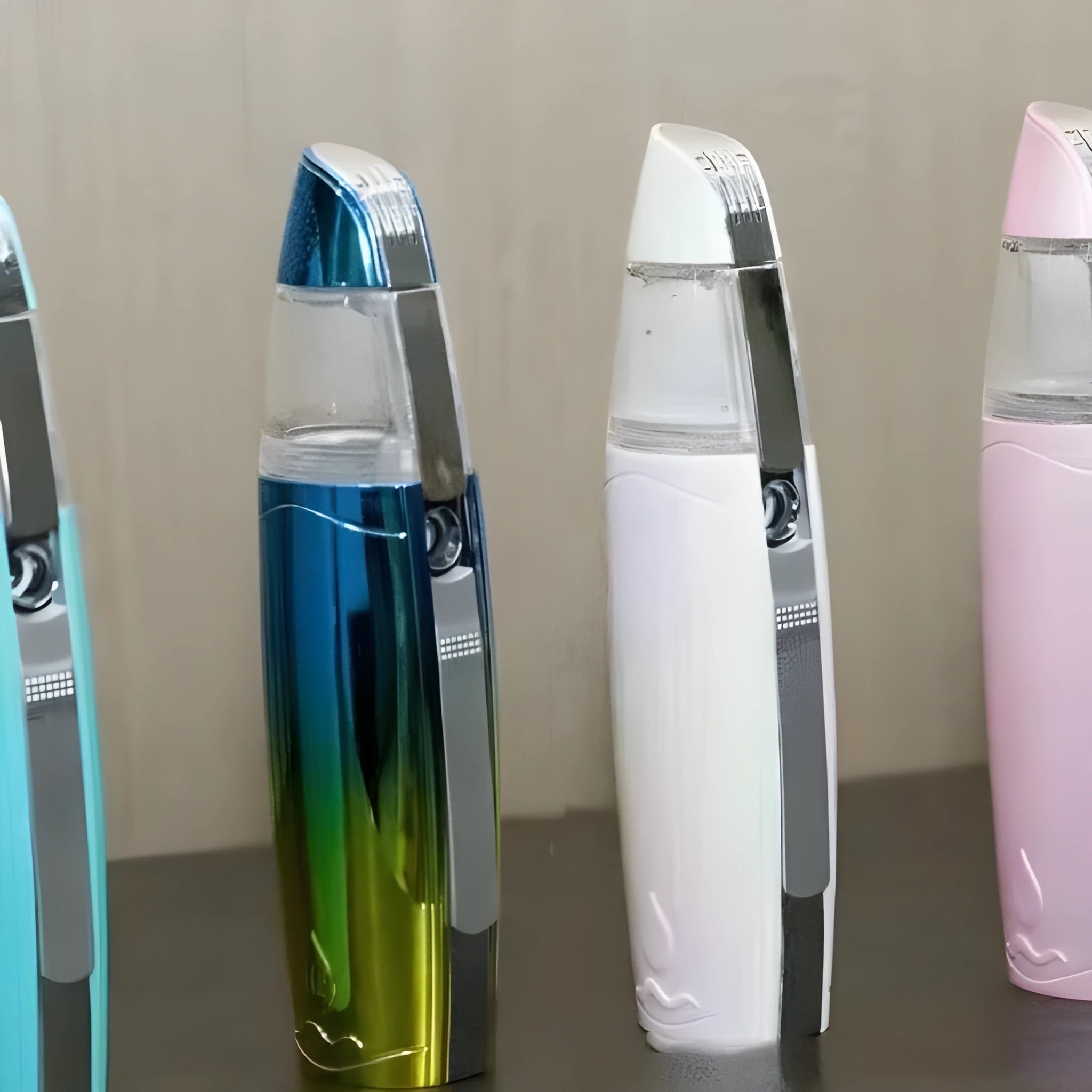Peacock blue handheld facial steamer with USB charging port