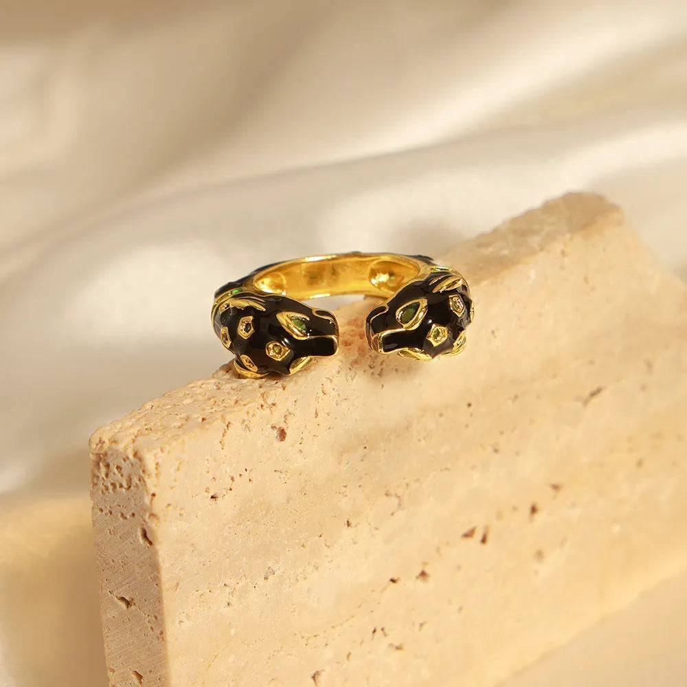 Black geometric open ring with cheetah oil drip pattern, size No. 7.