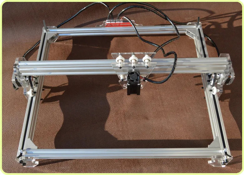 Miniature laser engraving machine with 3000mW power and 400x300mm work area for marking applications