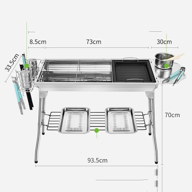 Large stainless steel portable folding barbecue oven set up outdoors.