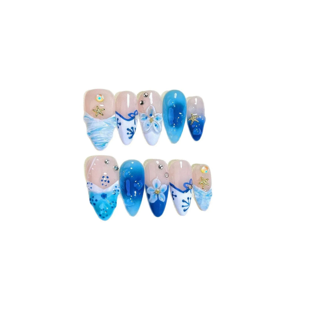 Set of blue hand-painted carved summer ice transparent plastic fake nails in sizes XS, S, M, L.