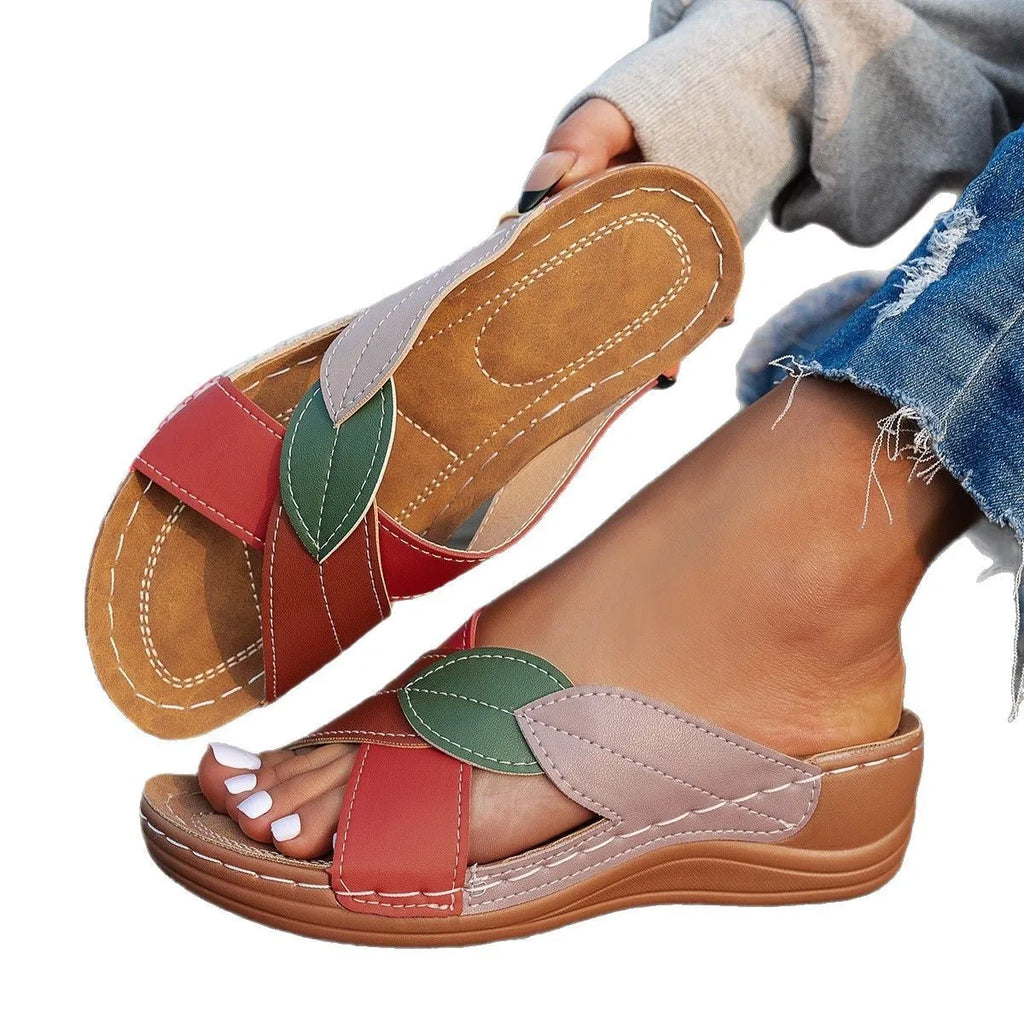 Women's black casual slipper with cross-strap and thick sole, open toe design