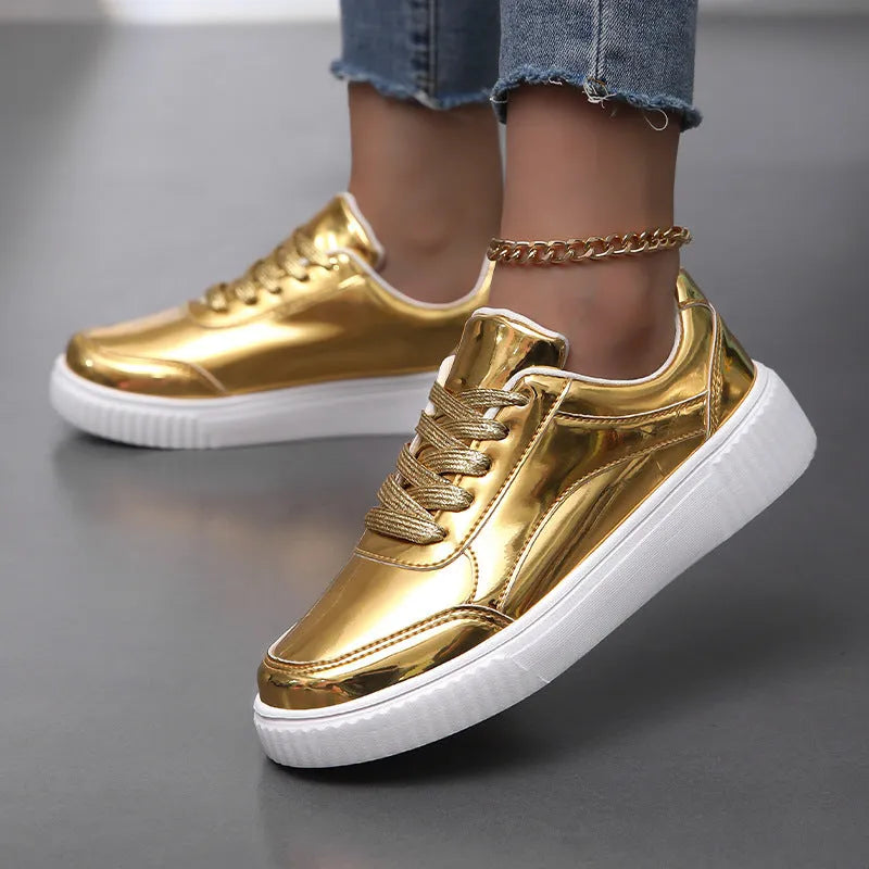 Gold platform sneaker with sequin upper and thick MD sole on a white background.