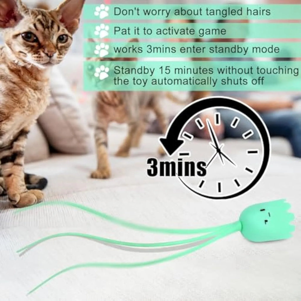 Green automatic cat wand toy with a swinging silicone tail on a white background.