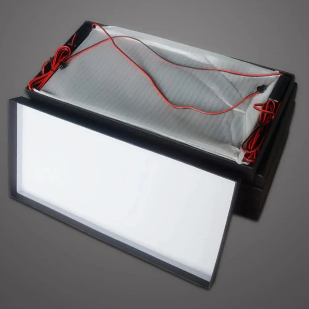 Two white plastic LED license plate lights for truck rear installation.