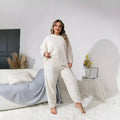 Women's creamy white polyester pyjama set with crew neck top and full-length trousers